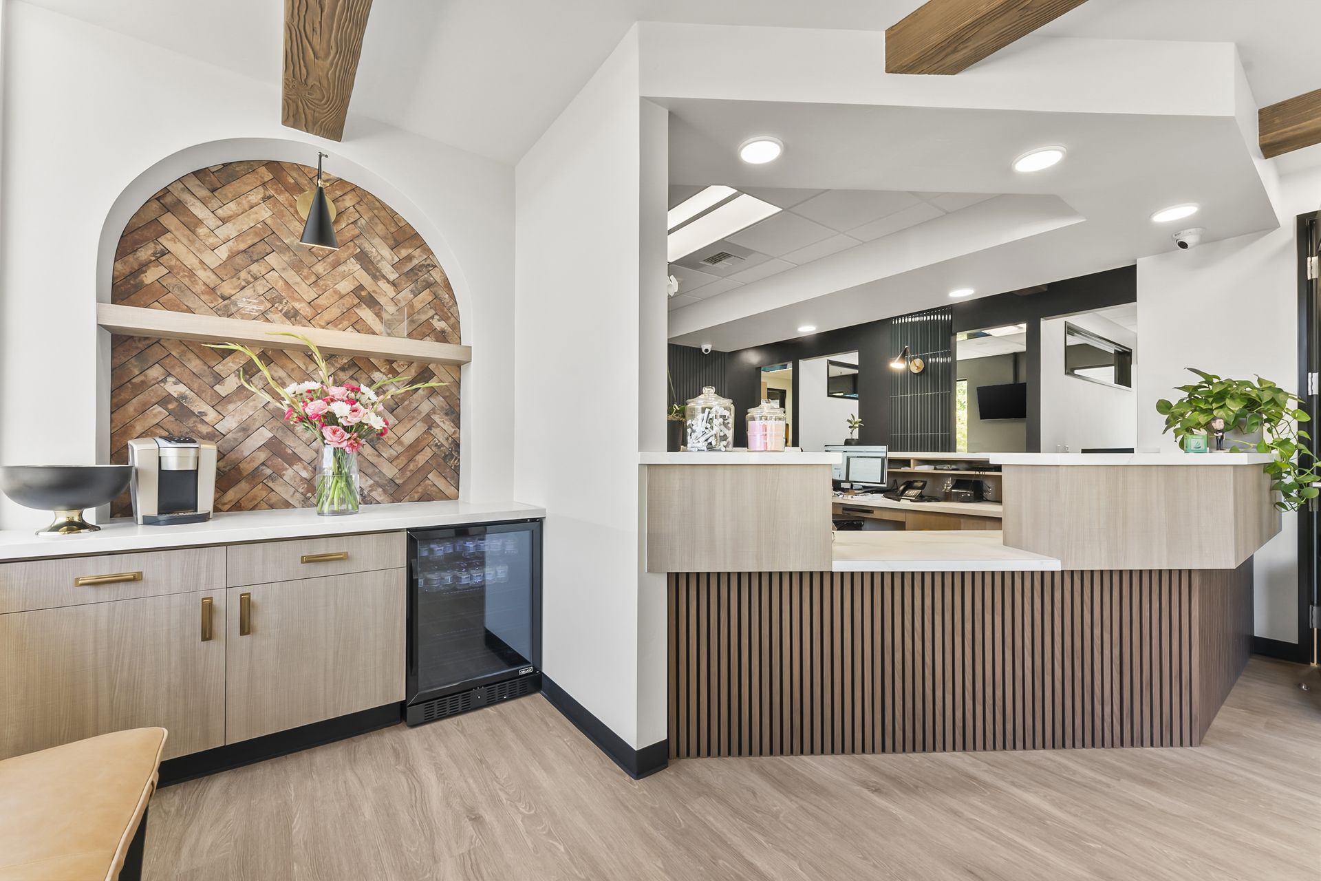 Beverage station with herringbone arch and flowers